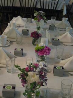 Mixed lavender, green and white wedding centerpieces at Stone Ba
